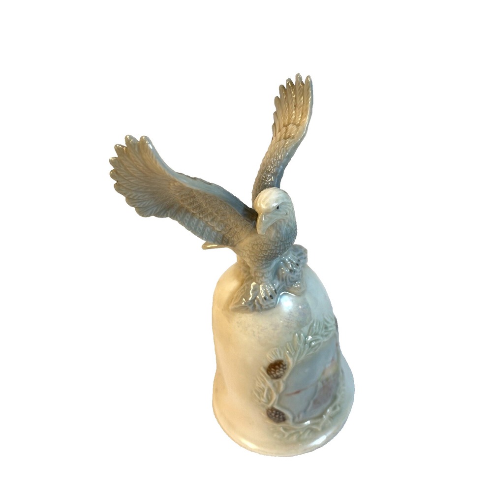 vintage eagle on top of a bell blue white